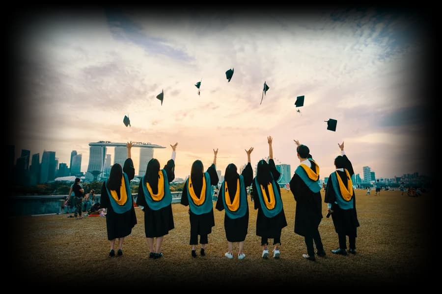 Graduates throwing their caps in the air