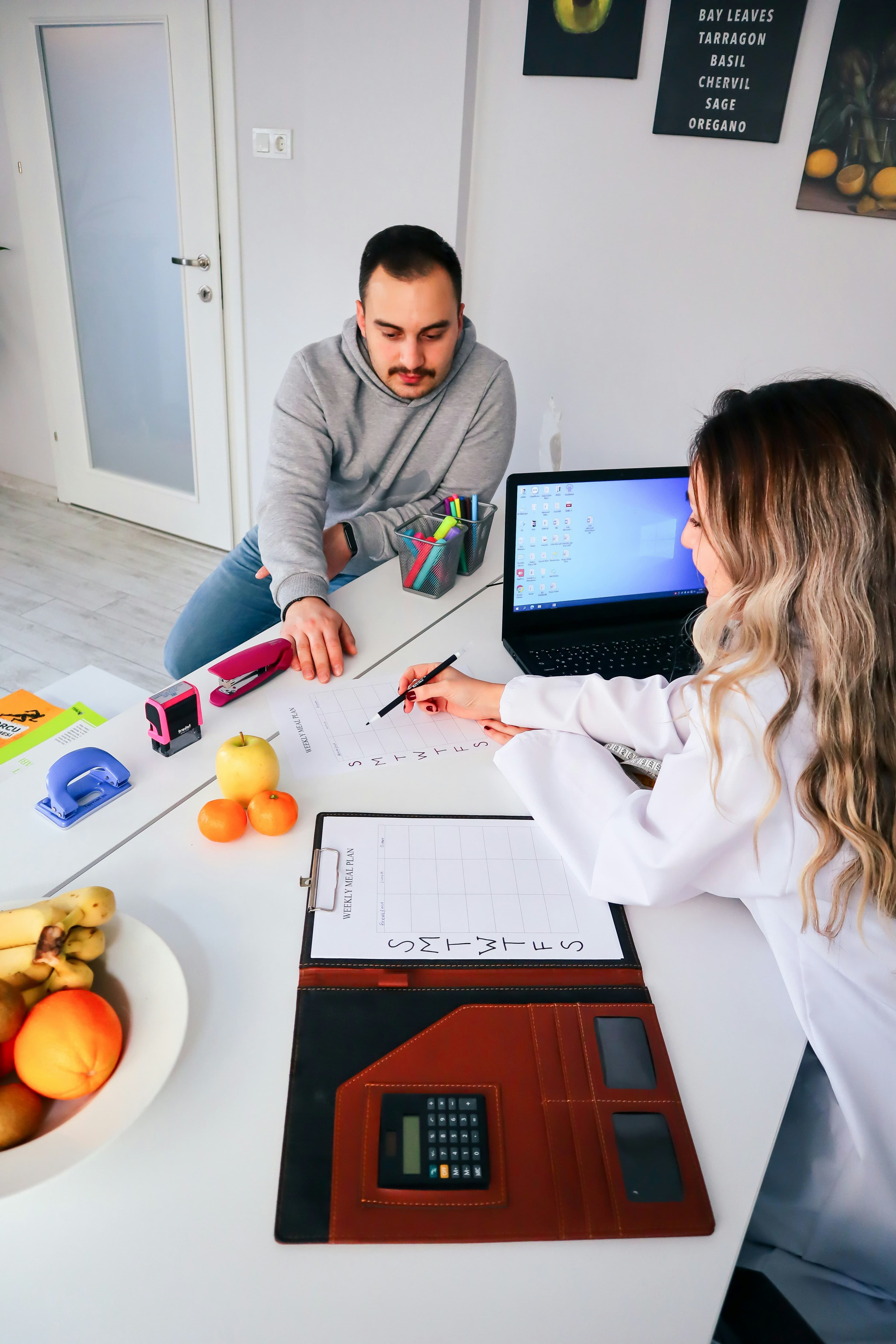 An IELTS trainer working one to one with a student